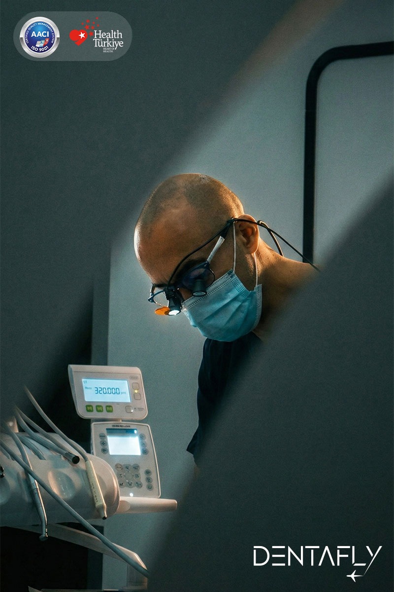Dr. Burak Gökdeniz precision dental work with loupe magnification expertise