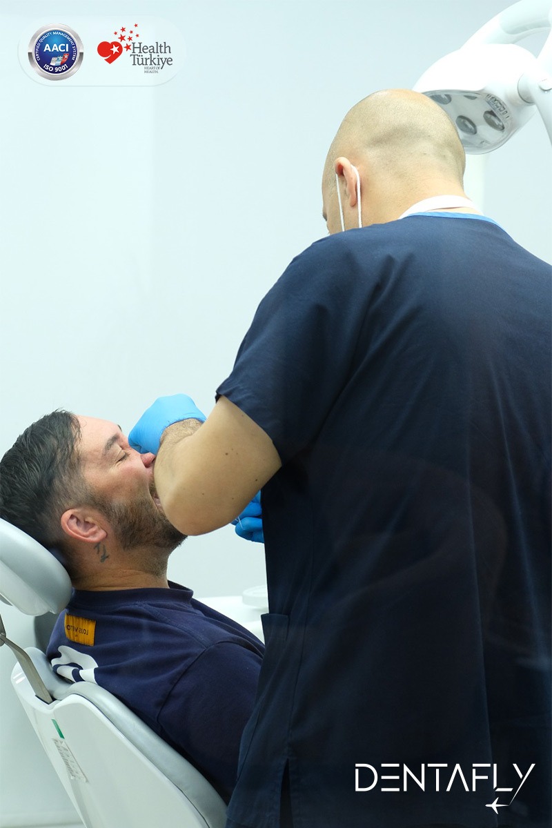 Dr. Burak Gökdeniz providing comfort care to nervous UK male patient